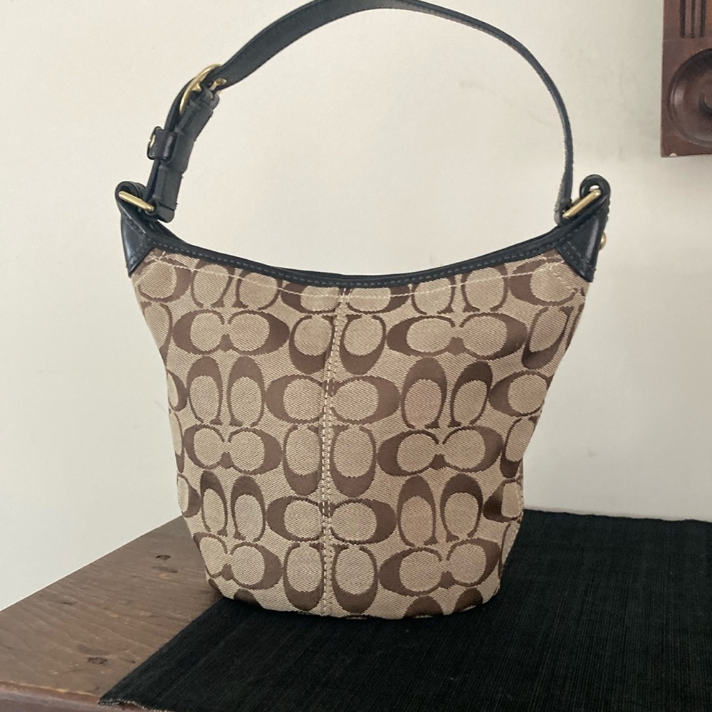 Coach Brown and Black Shoulder Bag with Adjustable Strap and Distinctive Pattern
